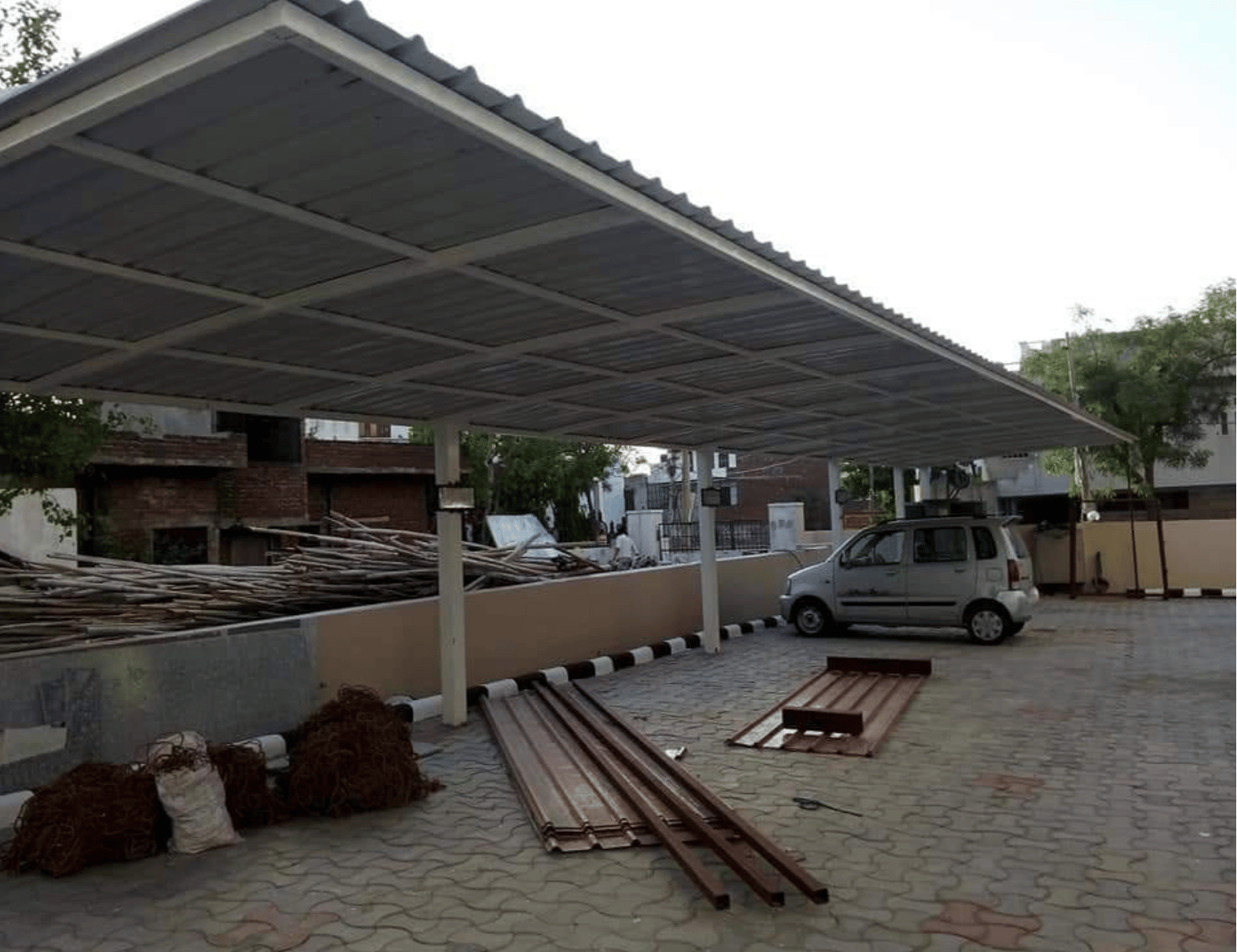 Corrugated car parking shades UAE - corrugated metal roofing parking shade structure for maximum weather protection