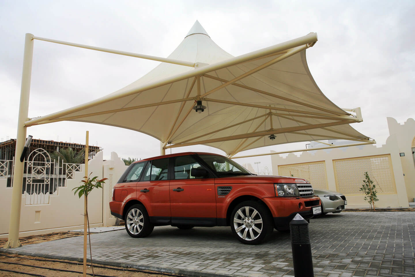 Rugged car parking shades UAE - heavy-duty industrial parking shade structure with reinforced steel framework