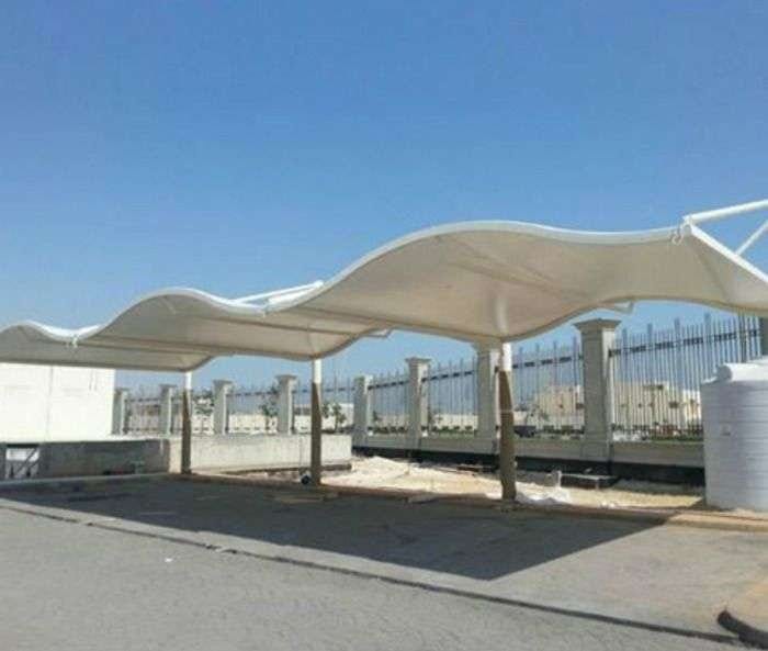Wave design car parking shades Dubai - elegant curved wave-shaped parking shade structure in UAE