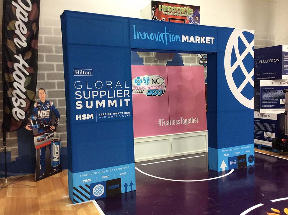 Event backdrop fabrication and custom branding by stage setup company in UAE