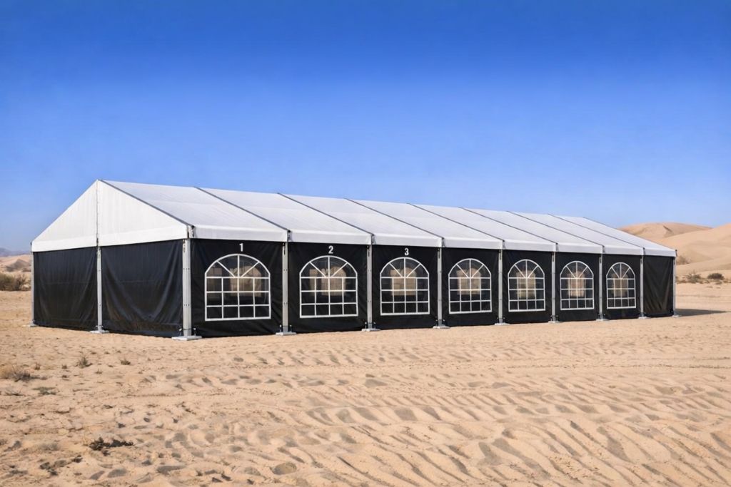 Black wall tent with arched windows in a UAE desert by Mahraj Industries - custom tent manufacturer