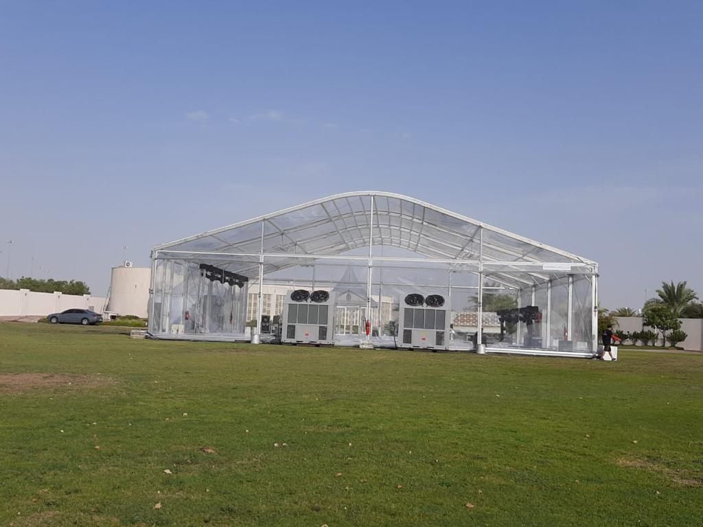 Transparent clear span tent with HVAC cooling systems installed by Mahraj Industries in UAE